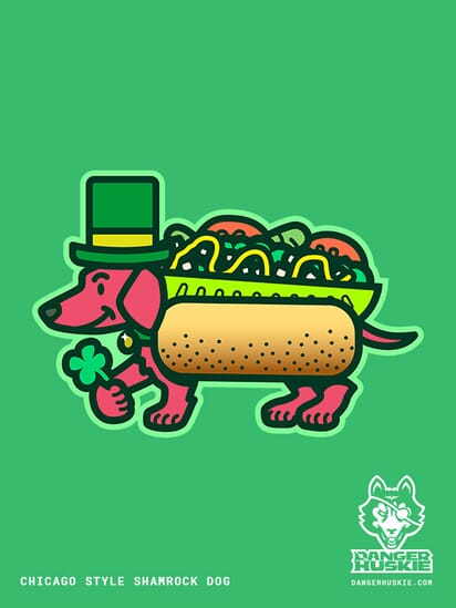 A friendly dachsund decked out as a chicago-style hot dog wears a festive St. Patrick's Day themed top hat and presents a luck four leaf clover!