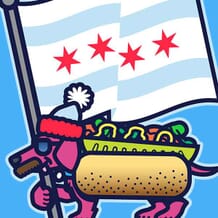 A friendly dachshund in a stocking cap with the colors of the Chicago flag and also sporting a costume with the toppings of the Chicago-style hot dog!