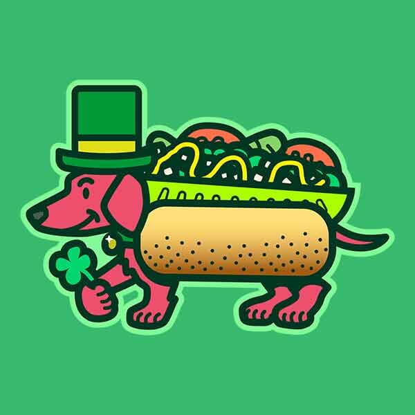 A friendly dachsund decked out as a chicago-style hot dog wears a festive St. Patrick's Day themed top hat and presents a luck four leaf clover!