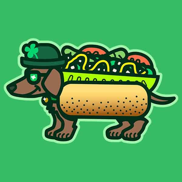 A smiling little dachshund is wearing green for St Patrick's Day in addition to a full sized Chicago-style hot dog costume!