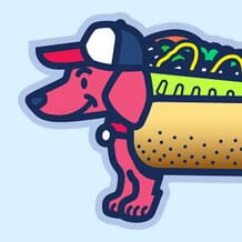 A smiling wiener dog wears a red, white and blue ballcap and a chicago-style hot dog costume.