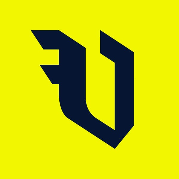 Volkert Design blackletter V in navy blue on a bright yellow solid background,Volkert Design logo and brand mark lockups on a bright yellow background,Outline versions of the Volkert Design V blackletter on a navy background with the text in bright yellow,Lockup of the Volkert Design logo with V brand mark in both dark and light modes