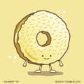 A donut made of gold stands proud with sparkles and sprinkles.