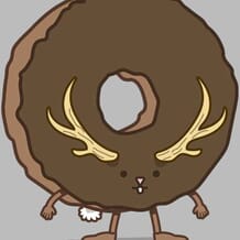A chocolate donut with a little rabbit face that has a pair of antlers jutting off of it.