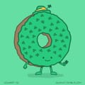 A donut dressed for St Patrick's Day.