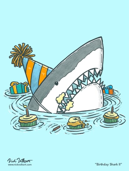 A shark emerges from the water with a half eaten cupcake, frosting on its face, and presents in the background.
